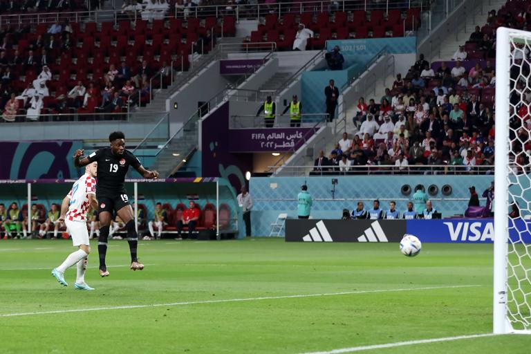 DOHA, QATAR - NOVEMBER 27: Alphonso Davies of Canada scores their team's first goal during the FIFA World Cup Qatar 2022 Group F match between Croatia and Canada at Khalifa International Stadium on November 27, 2022 in Doha, Qatar. (Photo by Alex Grimm/Getty Images)