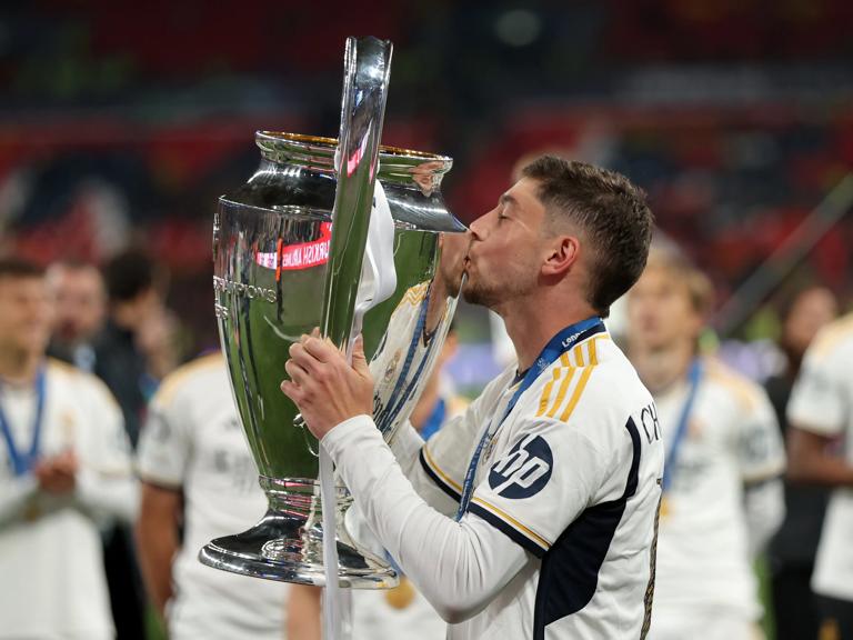 LONDON, ENGLAND - JUNE 01: Federico Valverde of Real Madrid celebrates with the UEFA Champions League Trophy after his team's victory in the UEFA Champions League 2023/24 Final match between Borussia Dortmund and Real Madrid CF at Wembley Stadium on June 01, 2024 in London, England. (Photo by Alex Pantling/Getty Images)